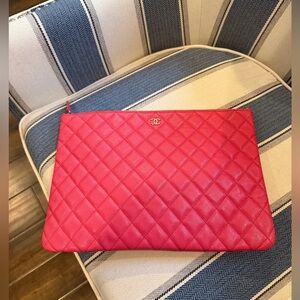 CHANEL O CASE CLUTCHES